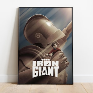 May include: A poster for the animated film "The Iron Giant" featuring a large, metallic robot with a young boy standing on its hand. The robot is brown and silver, and the boy is wearing a red shirt and blue trousers. The poster has a blue and white background.