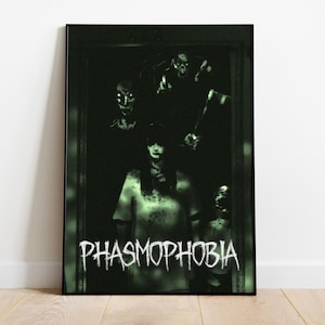 May include: A framed vertical poster featuring a dark, green-tinted scene with multiple ghostly figures emerging from a doorway. The word PHASMOPHOBIA is printed in a distressed white font at the bottom of the artwork, set against a black background.