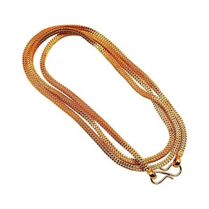 May include: A gold chain necklace with multiple strands, featuring a textured design. The necklace has two hook clasps.