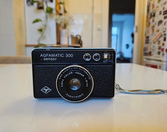 Agfa Agfamatic 300 Sensor vintage 126 film viewfinder camera with Agfa Color-Agnar 44 mm 8 and Paratortronic Shutter, decorative old camera