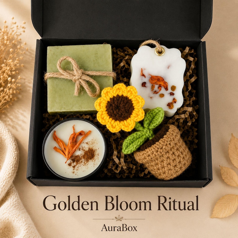 Fall gift box for women featuring a cozy autumn gift basket beautifully arranged in a premium black gift box with pumpkin accent, warm knit socks, sunflower detail, botanical candle, artisan soap and harvest-inspired gifts. Harvest Bliss Box is styled in rich orange, brown, golden yellow and cream fall colors, perfect as a Thanksgiving gift, hostess gift, fall birthday gift, pumpkin care package, autumn gift basket or cozy gift for her.