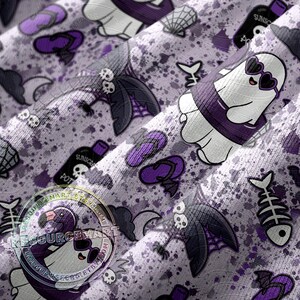 May include: A light purple fabric with a repeating pattern of cartoon ghosts wearing sunglasses, bats, flip-flops, and fish skeletons. The design includes bottles of sunscreen and a flamingo ghost. The fabric has a splatter effect.