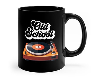May include: Black ceramic mug with a white graphic of a vintage record player and the text "Old School" in a retro font.