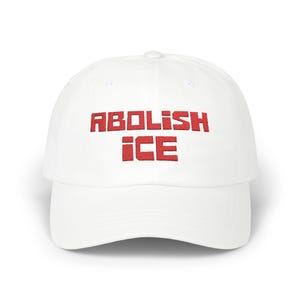 May include: White baseball cap with red embroidered text that reads "ABOLISH ICE".