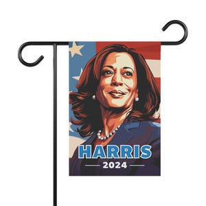May include: A red, white, and blue garden flag with a portrait of Kamala Harris and the text "HARRIS 2024".