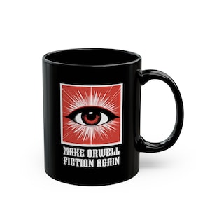 May include: Black ceramic mug with a red and white graphic of an eye with the text "Make Orwell Fiction Again".