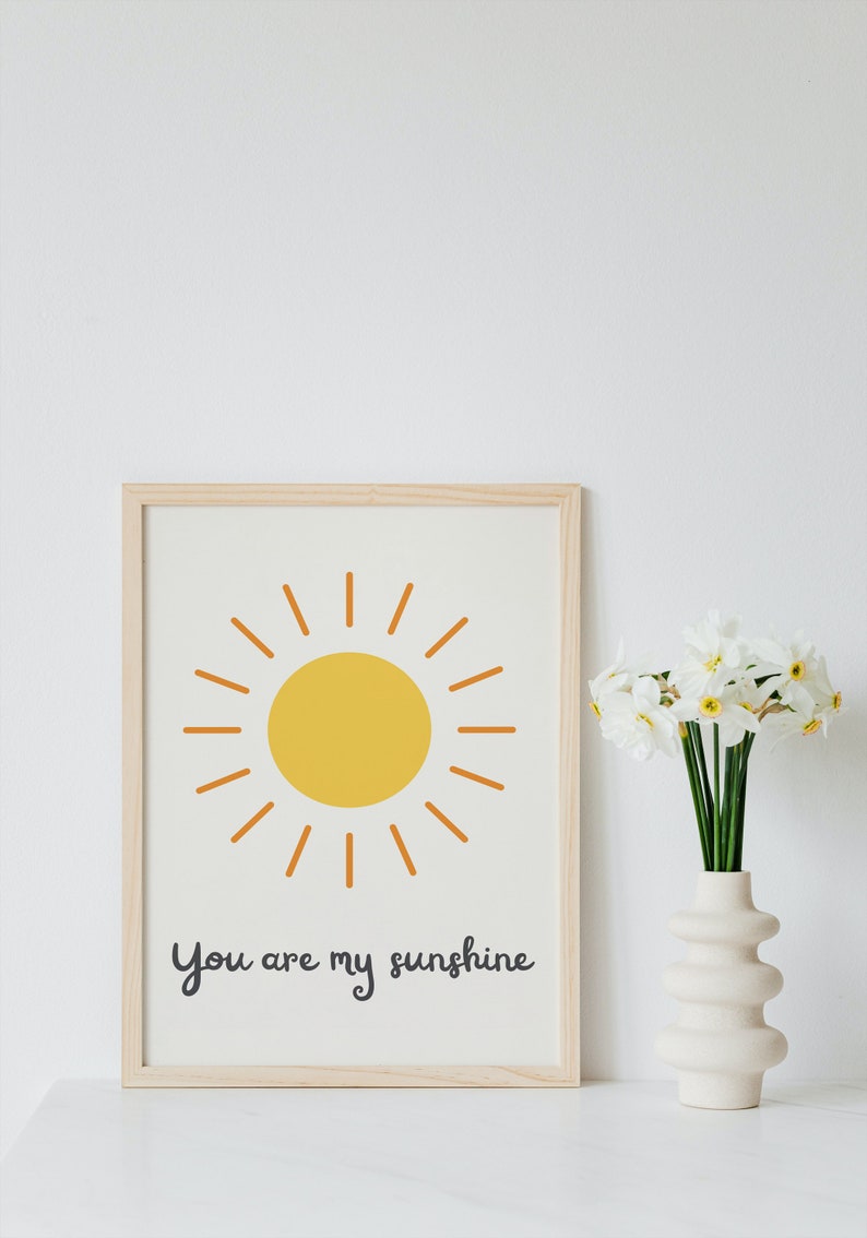 Heartwarming 'You Are My Sunshine' digital print featuring a vibrant sun, perfect for a nursery or playroom. Instant download to brighten your child's space with love and positivity.