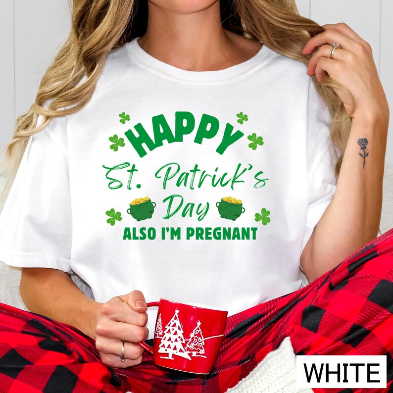 A woman wearing a white t-shirt with a humorous text and graphics related to St. Patrick's Day, including a mug with a Christmas tree design.