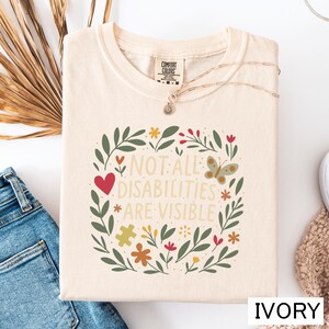 a t - shirt that says not all disabilities are visible