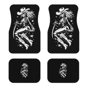 May include: A set of four black car floor mats. Each mat features a white illustration of a skeleton cowgirl wearing a hat and boots, holding a sword, and surrounded by stars.