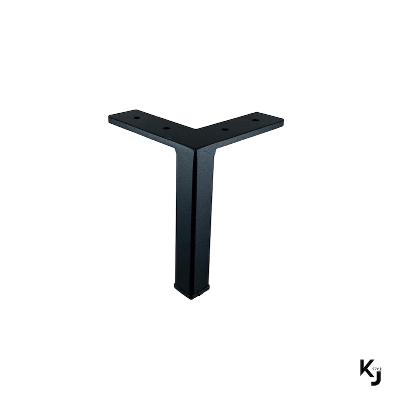 May include: Black metal L-shaped table leg with a square base. The leg is approximately 12 inches tall.
