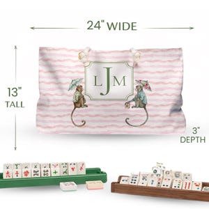 Pink and Green Monkey Mahjong Tote Bag and Tile Pouch Set on a white bamboo table, Palm Beach style
