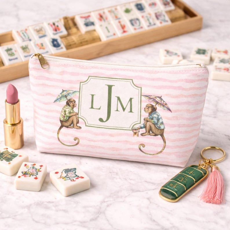 Pink and Green Monkey Mahjong Tote Bag and Tile Pouch Set on a white bamboo table, Palm Beach style