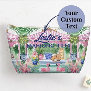 A personalized Mahjong tile bag with tropical artwork. A round label points to the text area where a custom name can be added above the words “Mahjong Tiles.”
