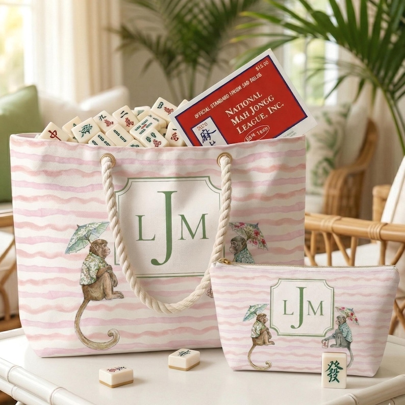 Pink and Green Monkey Mahjong Tote Bag and Tile Pouch Set on a white bamboo table, Palm Beach style