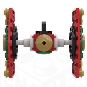 Puede incluir: Una nave espacial LEGO roja, verde y negra con un disco dorado en el centro. La nave espacial tiene dos alas grandes a cada lado.