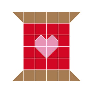 Puede incluir: Una bobina de hilo roja y marrón con un corazón rosa en el centro.