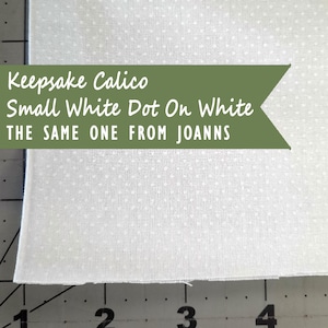 May include: White fabric with small white polka dots. The text on the image reads: Keepsake Calico, Small White Dot On White, THE SAME ONE FROM JOANNS.