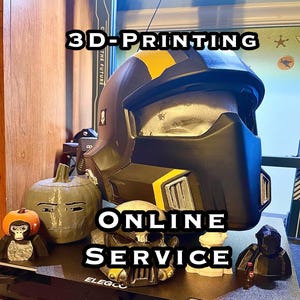 May include: A 3D printed helmet with a black and yellow design. The helmet is sitting on a table with other 3D printed objects. The text "3D-Printing Online Service" is visible in the image.