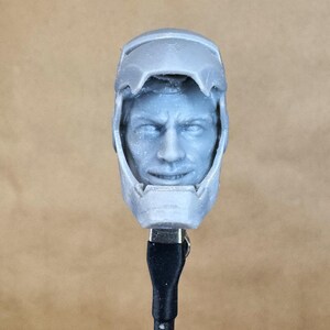 Custom IRON MAN Mark III (Tony Stark) Head in 8k resin. Sculpt by BlueDSculptures and produced at the Los Angeles studio. 
Front view.
