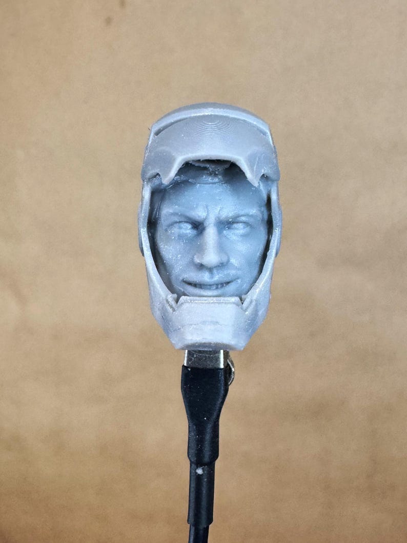 Custom IRON MAN Mark III (Tony Stark) Head in 8k resin. Sculpt by BlueDSculptures and produced at the Los Angeles studio. 
Front view.