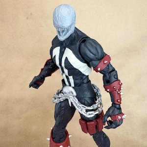 Custom VENOM resin Head, inspired by the Raimi Spider-Man movie. Sculpt by JCirion3d, and produced by me in my Los Angeles studio. 
7 inch scale on a McFarlane figure.