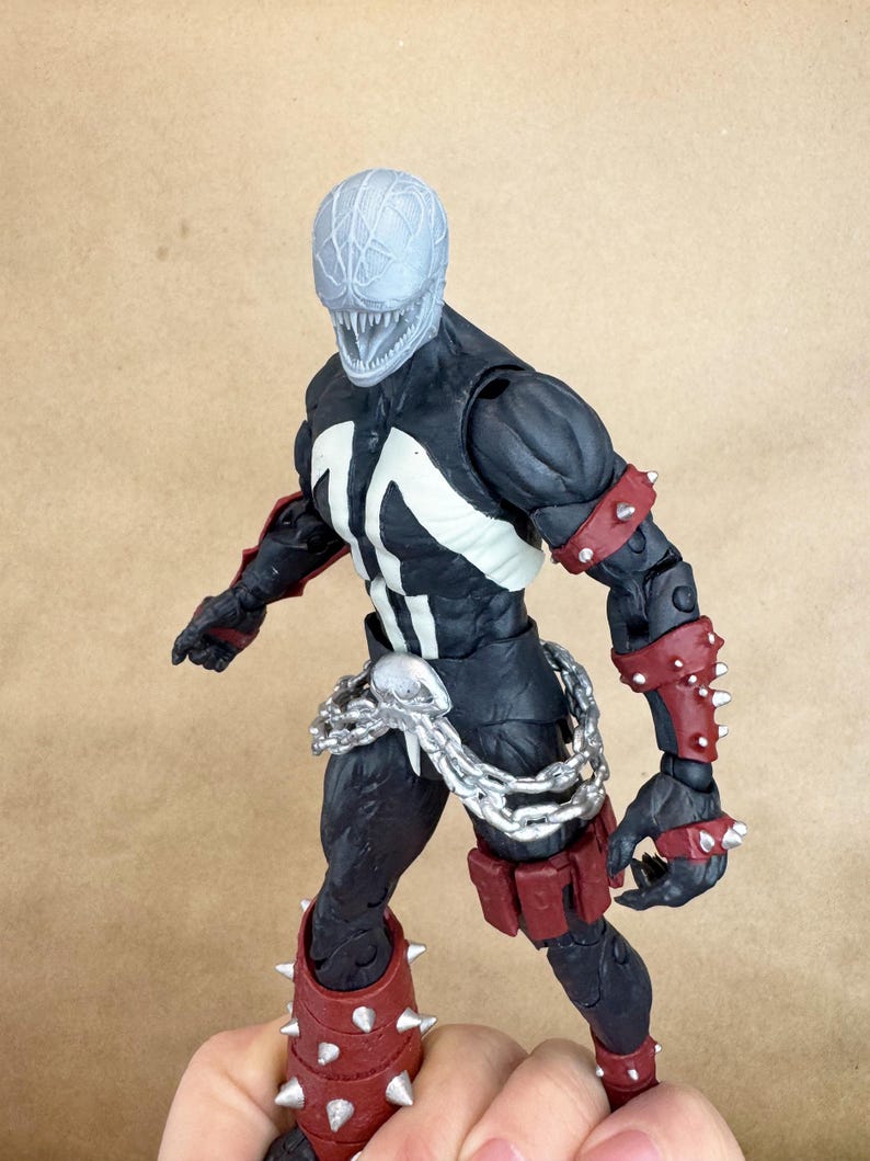 Custom VENOM resin Head, inspired by the Raimi Spider-Man movie. Sculpt by JCirion3d, and produced by me in my Los Angeles studio. 
7 inch scale on a McFarlane figure.