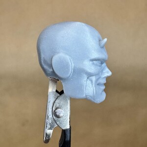 Custom DAREDEVIL (Waid/ Samnee) head in 8k resin. Sculpt by Orobus and produced at the Los Angeles studio. 
Side view.