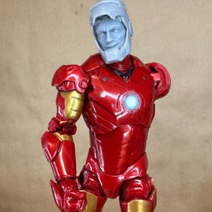 Custom IRON MAN Mark III (Tony Stark) Head in 8k resin. Sculpt by BlueDSculptures and produced at the Los Angeles studio.6 inch version on a Legends figure.