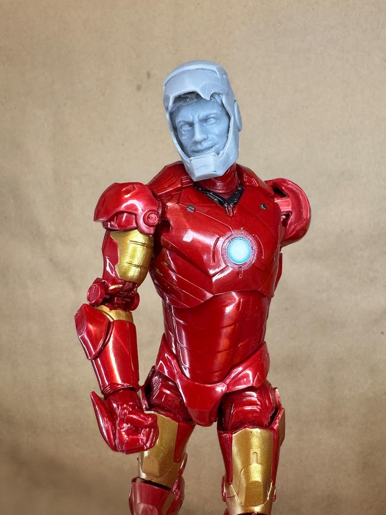 Custom IRON MAN Mark III (Tony Stark) Head in 8k resin. Sculpt by BlueDSculptures and produced at the Los Angeles studio.6 inch version on a Legends figure.