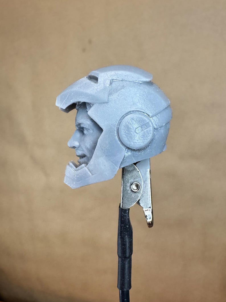 Custom IRON MAN Mark III (Tony Stark) Head in 8k resin. Sculpt by BlueDSculptures and produced at the Los Angeles studio. 
Side view.