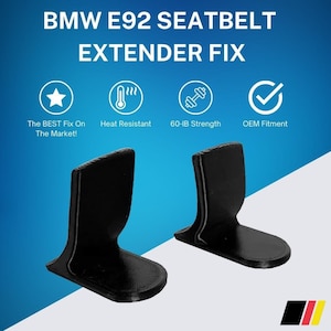 May include: Two black plastic seatbelt extenders for a BMW E92. The extenders are designed to fix a common problem with seatbelts in this model. The text on the image reads "BMW E92 SEATBELT EXTENDER FIX".