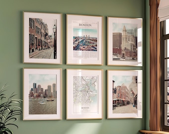 May include: Six framed art prints of Boston scenes hang on a green wall. The prints feature cityscapes, a map, and street views, all with gold frames. The top center print has the word "BOSTON" at the top.