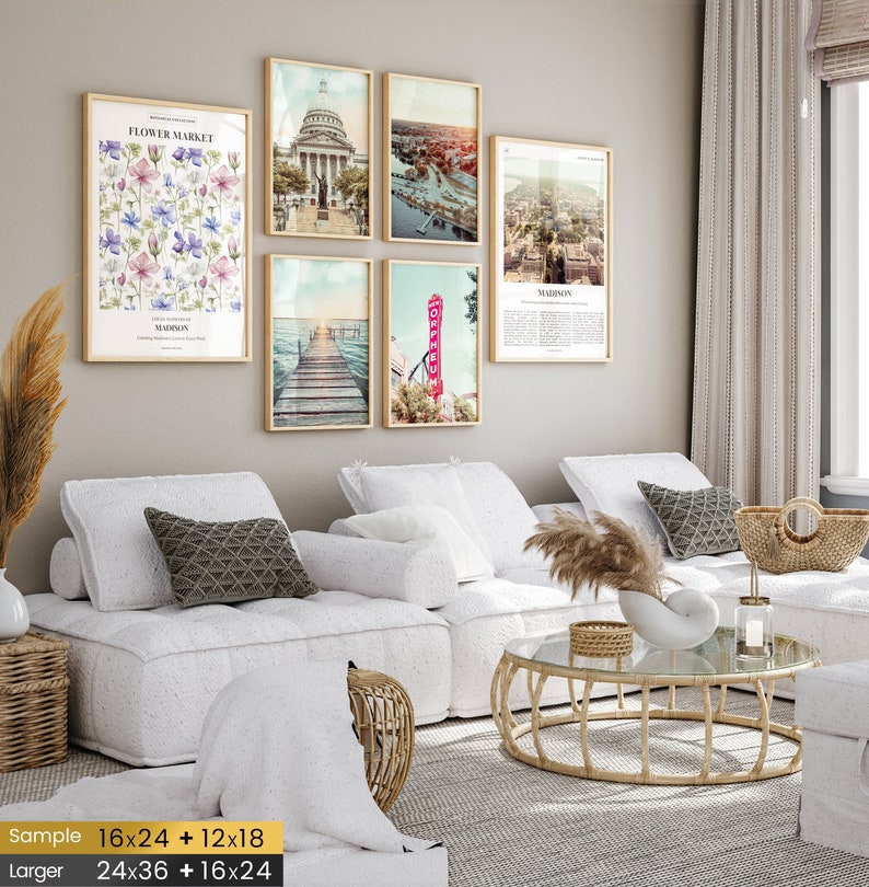 May include: A set of six framed prints featuring various scenes of Madison, Wisconsin. The prints are arranged in a grid pattern on a wall with a white couch and a coffee table in the foreground.