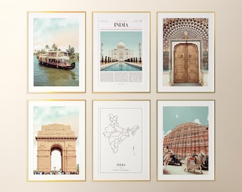 May include: Set of six framed art prints featuring scenes from India. Images include a houseboat on a river, the Taj Mahal, a detailed doorway, the India Gate, a map of India, and the Hawa Mahal palace. Each print is in a gold frame.