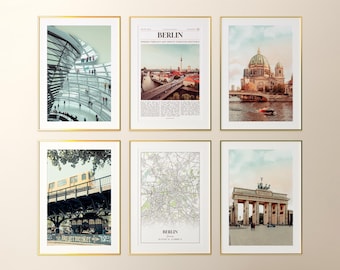 May include: Six framed art prints with gold frames. The prints feature images of Berlin, Germany, including architectural structures, cityscapes, and a map. The prints are displayed against a neutral background.