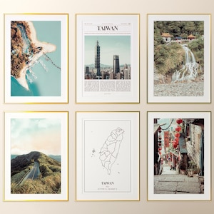 May include: Six framed art prints with gold borders. The prints feature scenic views of Taiwan, including a coastal aerial view, a cityscape with the Taipei 101 tower, a waterfall, a mountain road, a map, and a street scene with red lanterns.