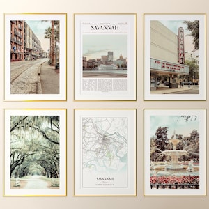 May include: Six framed art prints with gold frames. The prints feature images of Savannah, Georgia, including street scenes, a theater marquee, a map, and a fountain. The prints are in a variety of sizes and orientations.