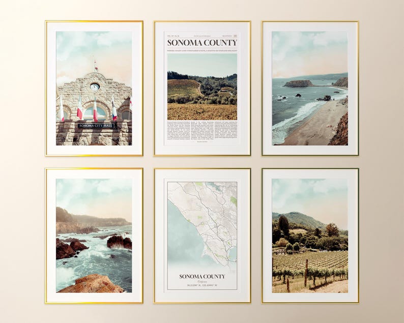 May include: Six framed art prints with gold frames. The prints feature scenic views of Sonoma County, California, including a city hall, coastal landscapes, a map, and vineyards. The prints have a vintage aesthetic with muted colors.