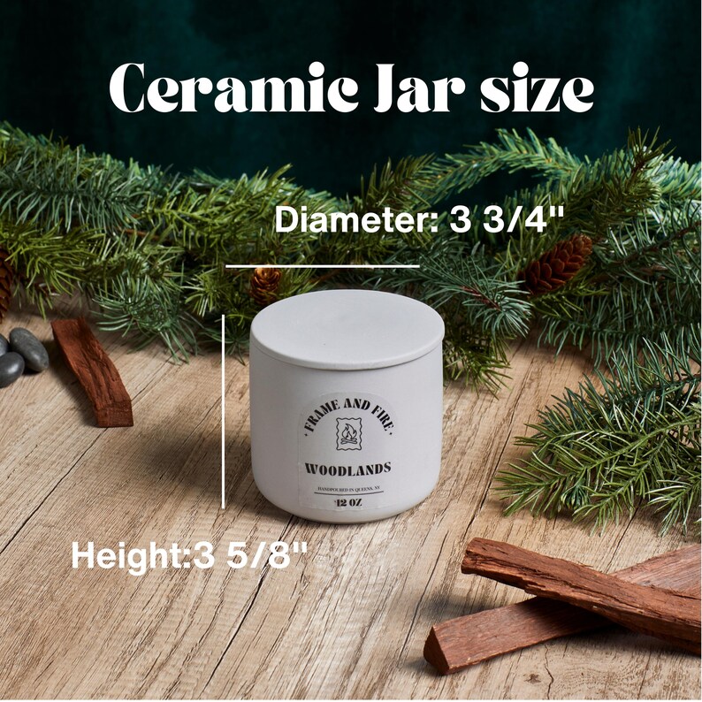 May include: White ceramic jar candle with a black label that reads "Frame and Fire Woodlands 12 oz". The jar is 3 3/4 inches in diameter and 3 5/8 inches tall.