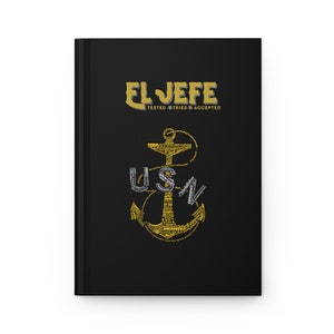 May include: Black notebook with the words "EL JEFE" in gold lettering. Below the title are the words "TESTED * TRIED * ACCEPTED". An anchor design with the letters "USN" is in the center of the notebook.