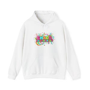 May include: White hoodie with a front pocket and a drawstring. The front displays a vibrant graphic with the words "CHAOS COORDINATOR" in a fun font, accented by stars, lines, and dots in pink, green, blue, and orange.