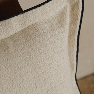 pillow with black piping