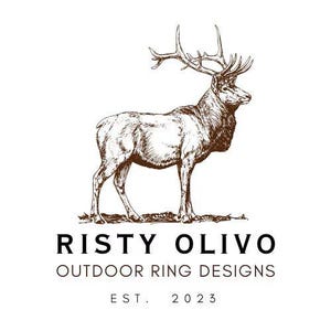 May include: A brown and white illustration of a majestic elk with large antlers. The elk stands on a patch of grass. The text "RISTY OLIVO OUTDOOR RING DESIGNS EST. 2023" is below the elk.