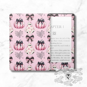 May include: A pink and black patterned Kindle Paperwhite case with a Halloween theme. The pattern features ghosts, pumpkins, bows, and spiderwebs. The text "APTER 1" is visible on the screen.