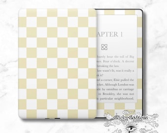 May include: A white and yellow checkered pattern on a Kindle e-reader. The screen displays the text "APTER 1" and a small symbol. The text below the chapter title reads "barely hear the toll of Big nce. Four o'clock. A decent breaking the law. law wasn't fit, was it really a uk it? nd a corner, Elsie pulled the ocket. Although London was ide by omnibus or carriage in Brookley, she was not is particular neighborhood."