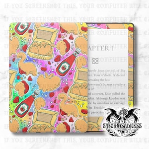 May include: A Kindle case with a colorful pattern of chicken nuggets, ketchup bottles, and strawberry shapes. The case has the text "CRYPTY NUGGETS" and "STICKY SADNESS". The open Kindle displays text from a book.