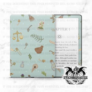 May include: A light blue e-reader cover with a repeating pattern of whimsical illustrations, including mushrooms, scales, and a mortar and pestle. The e-reader displays text from a book. The cover has the text "CHAPTER 1" and the logo "STICKY SADNESS".