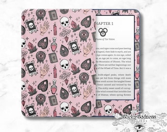May include: A pink and black patterned Kindle cover with a black and white illustration of a book and the text "Chapter 1 Flame of Tar Valon".