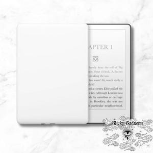 May include: A white e-reader with a black border and a white cover. The screen displays the text "APTER 1" and a paragraph of text. The text is in a serif font. The e-reader is sitting on a white surface.